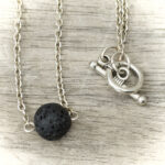 11230 Lava Stone New Moon Necklace